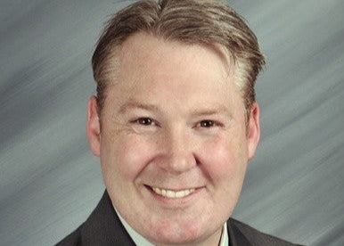 Advisory Board member, John Horne, for Marins Med with a grey background.